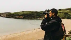 Man taking photos of ocean