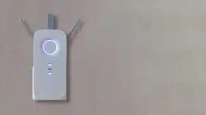 Wireless repeater, Wifi Extender on grey empty wall background. Network booster close up, copy space